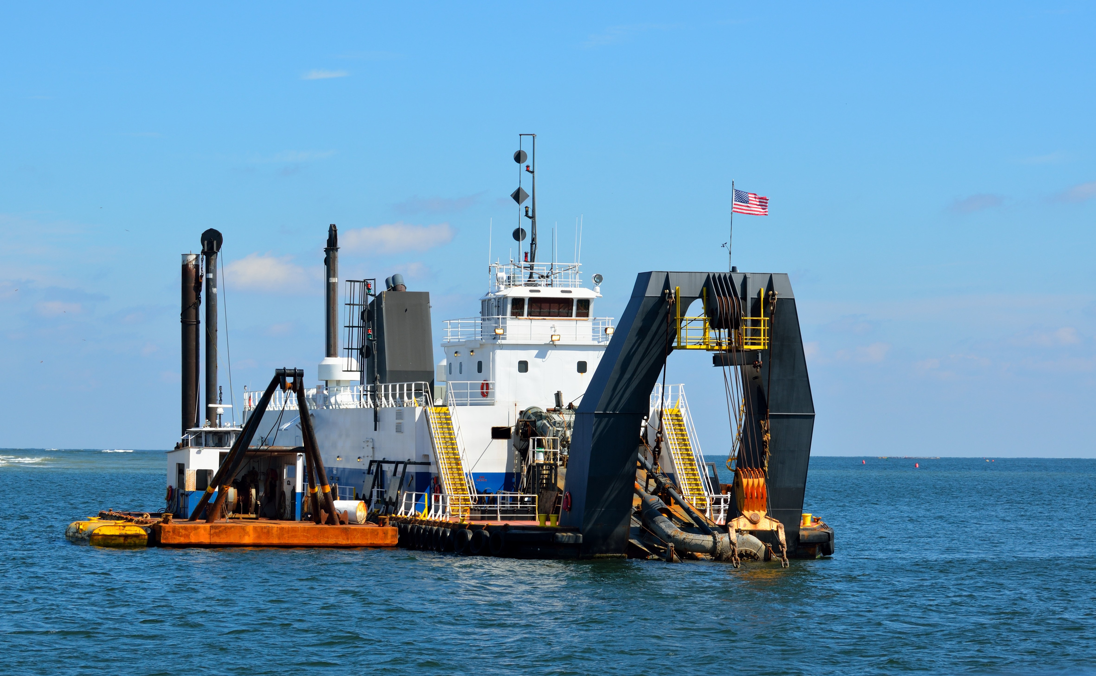 Dredger at ocean inlet Hughes Law Offices